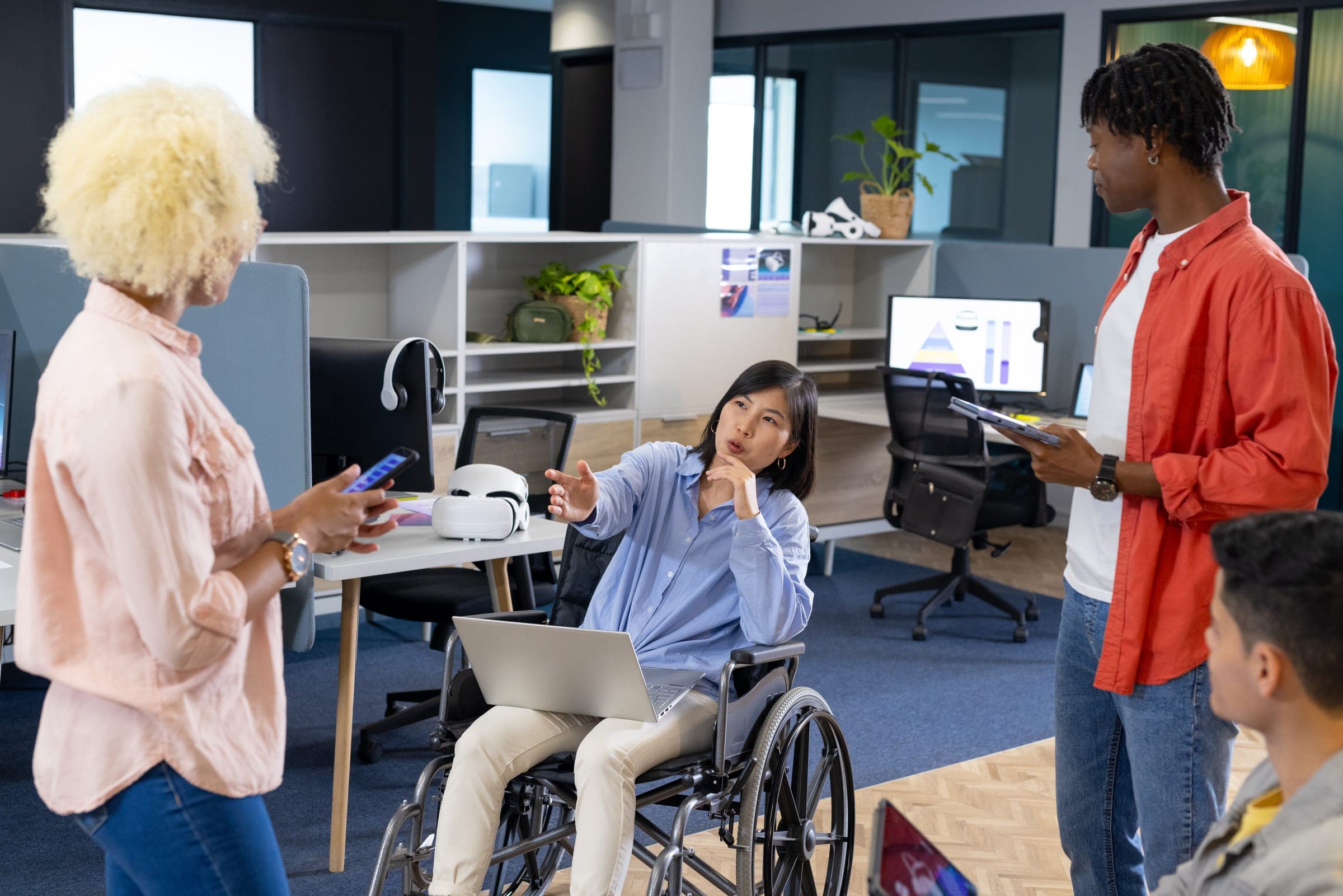 Group discussing NDIS insurance in a modern office.