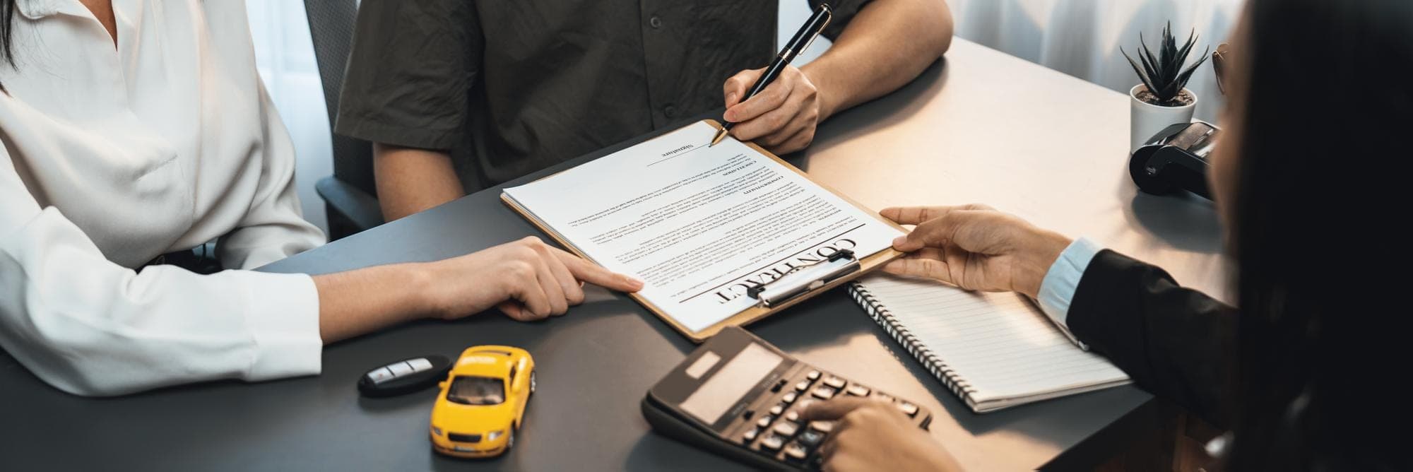 Insurance Claim Review Meeting People reviewing documents for a commercial insurance claim.