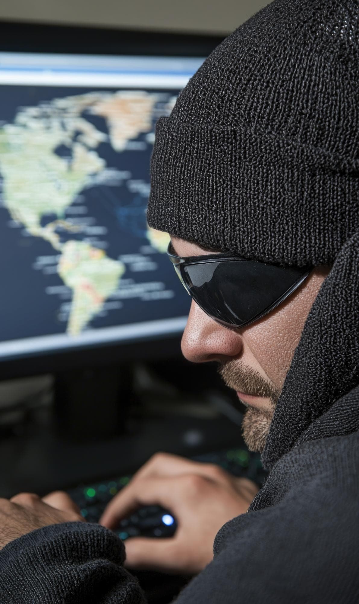 Hacker with computer reflecting tool theft concept, Gold Coast.