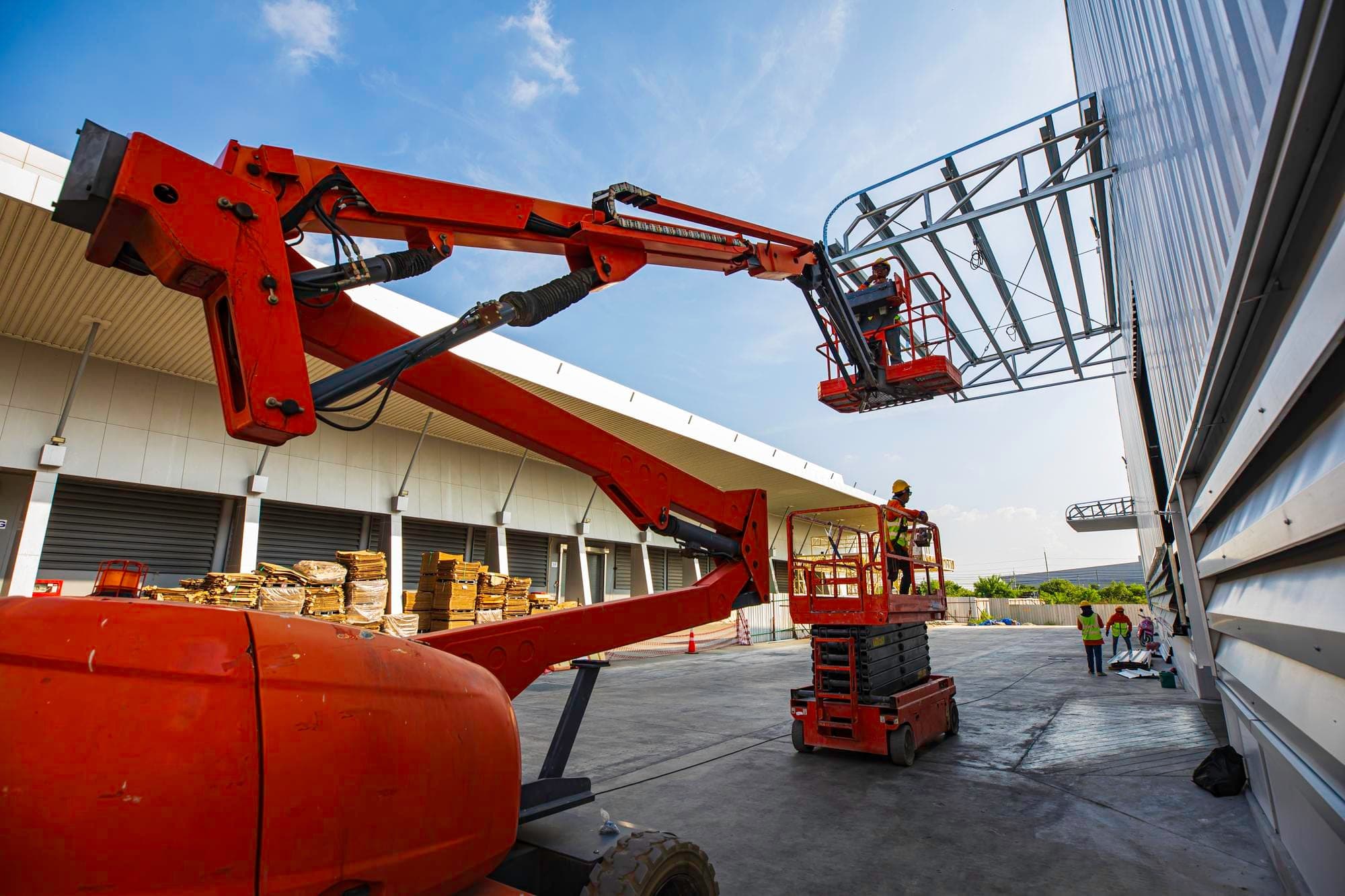 Scissor lift and equipment in use on a Queensland construction site.