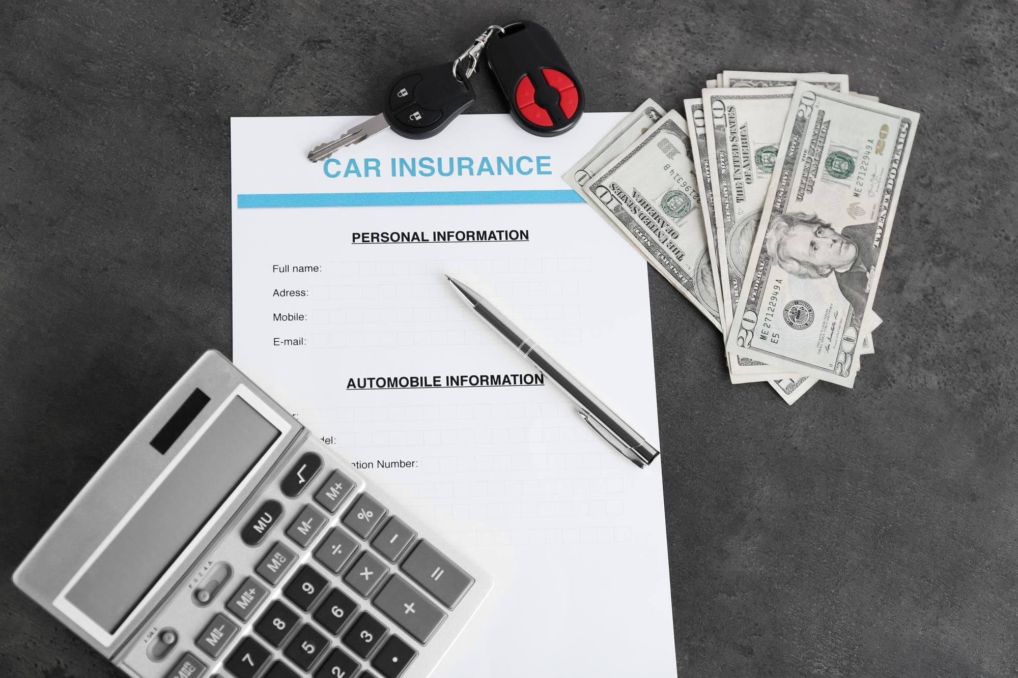 Insurance Document and Money Car insurance document with money and calculator, highlighting underinsurance issues.